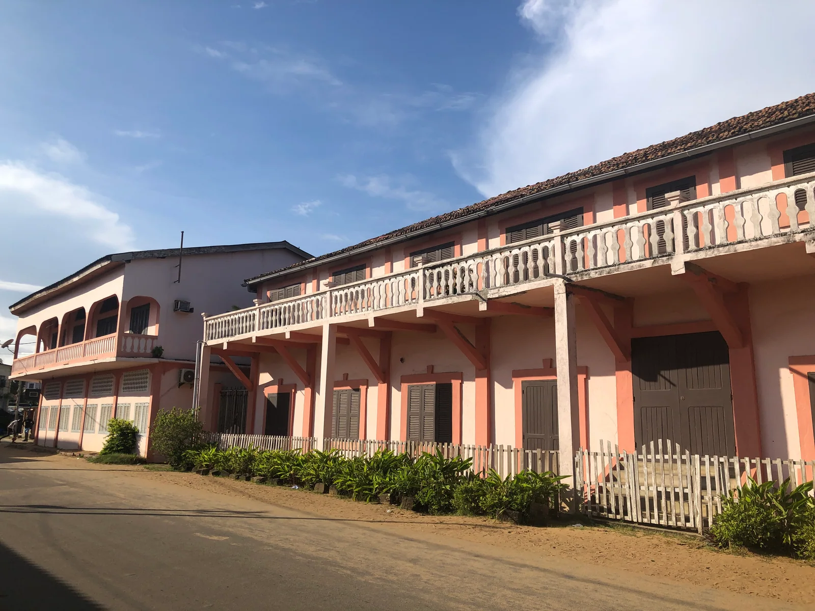 Street and historic buildings in Grand-Bassam, 2023. Context photograph.
